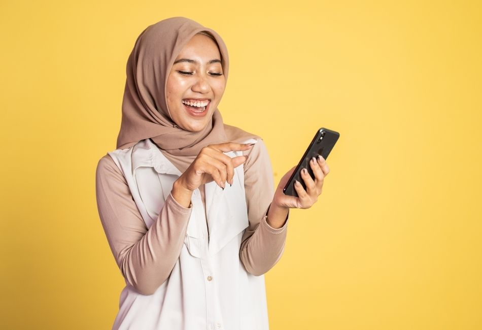 Woman taking a colorful selfie